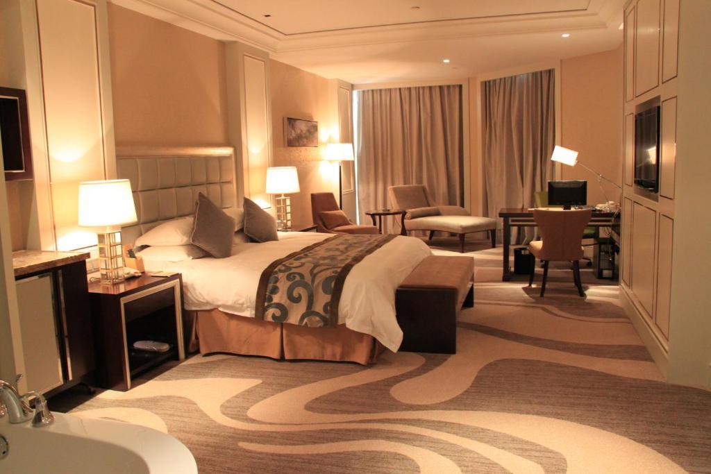 Landison Green Town Hotel Xinchang Quarto foto